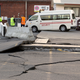 A paved road is lifted at the ports in Wellington, New Zealand, Monday, Nov. 14, 2016, following an earthquake. A powerful earthquake struck New Zealand's South Island early Monday, killing at least two people, causing damage to buildings and infrastructure, and prompting emergency services to warn people along the coast to move to higher ground to avoid tsunami waves.